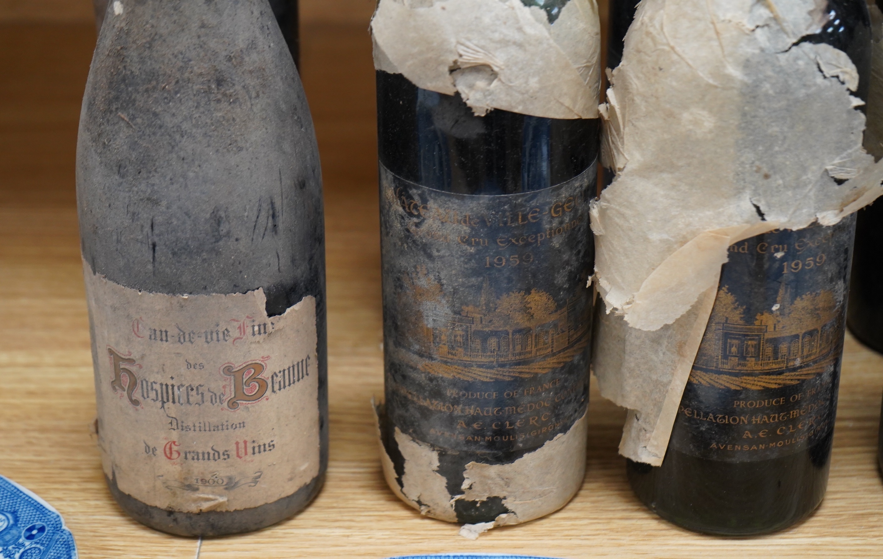 Ten bottles of red wines to include six bottles of mixed Claret/Bordeaux, four bottles Chateau de Ville-George’s, Grand Cru 1959, two bottles of Chateau Leoville Barton 1947 and two others without labels, a bottle Cau de